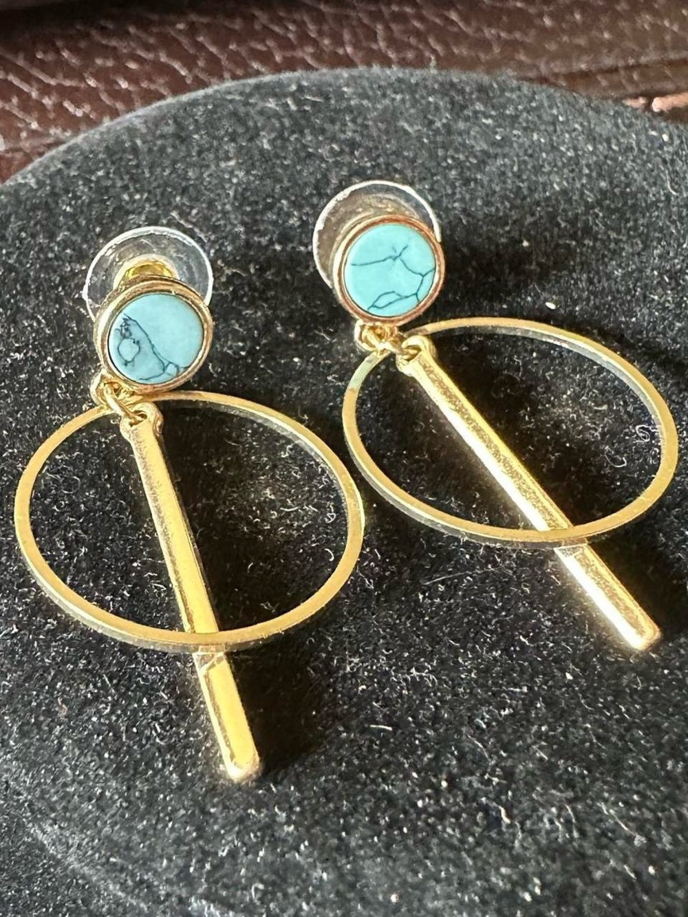 Vintage golden dangling hoop earrings.